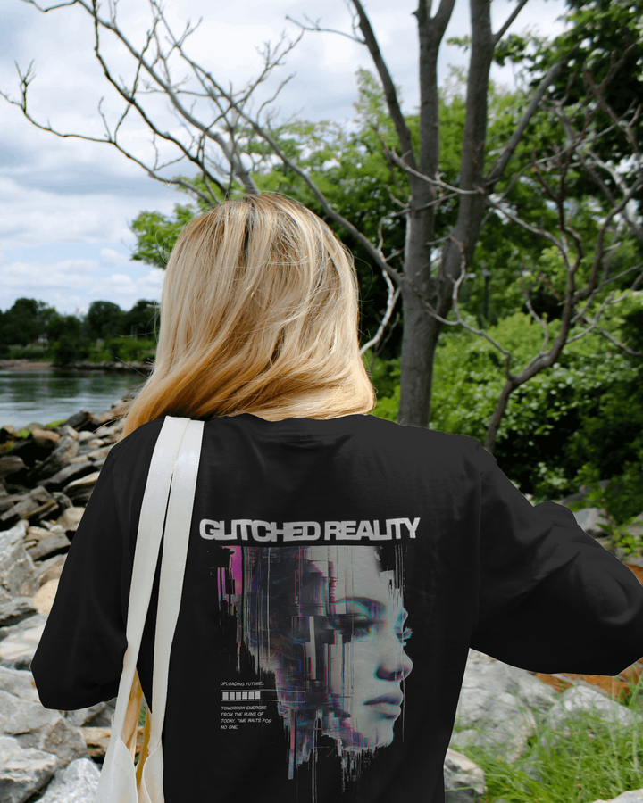 Back view of Glitched Reality T-Shirt showcasing artistic glitch design in natural light