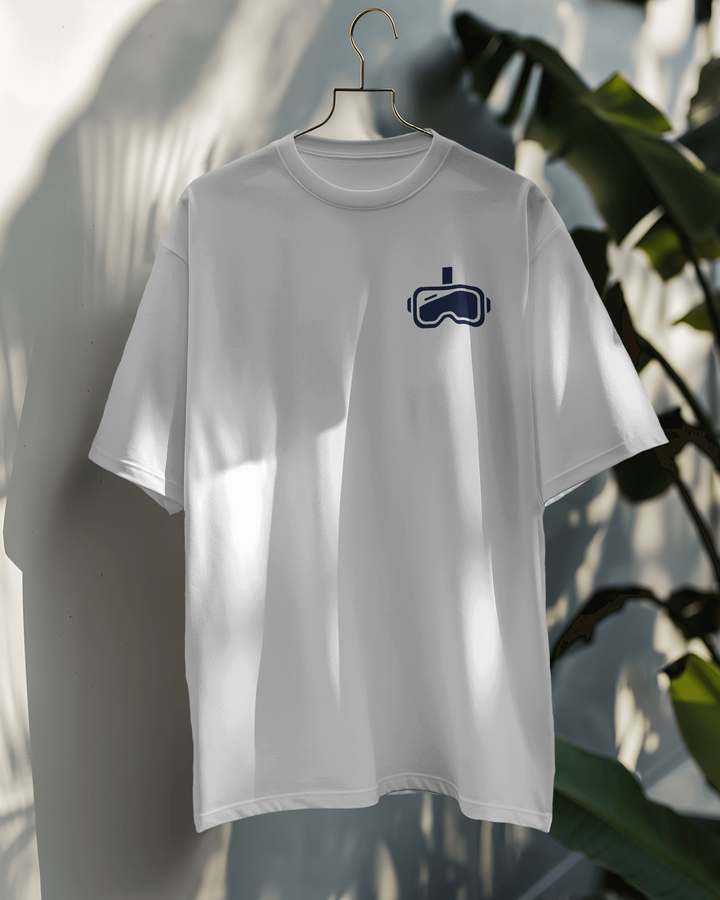 Front view of hanging Beyond Reality white oversized T-shirt with sleek headset icon