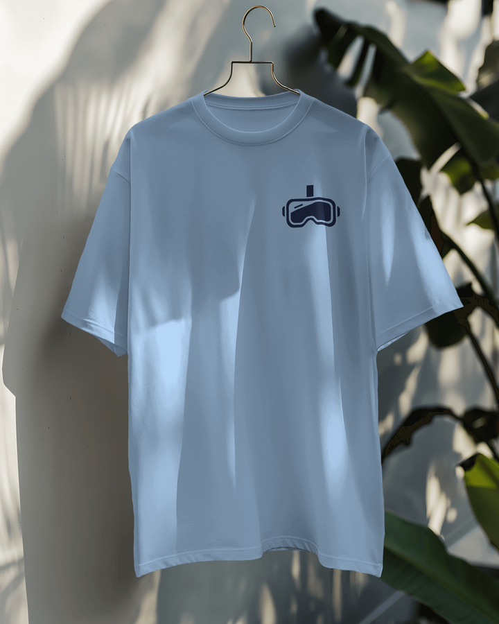 ront view of Beyond Reality baby blue oversized T-shirt with sleek headset icon