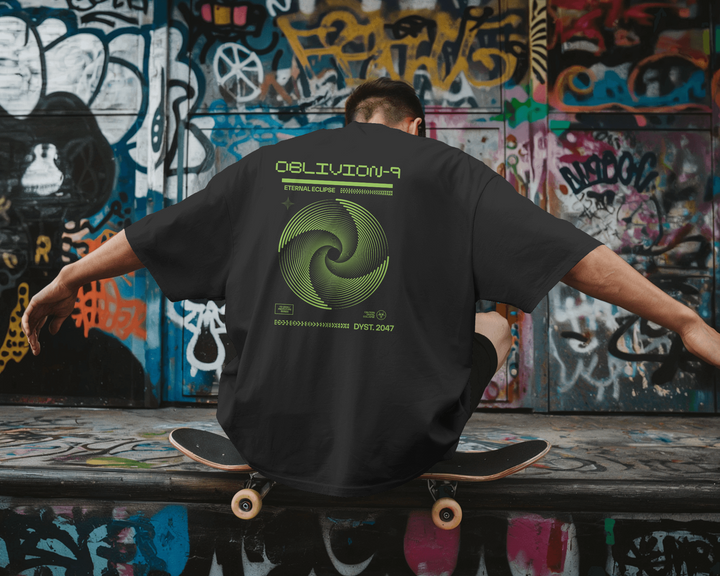 Back view of Oblivion-9 T-Shirt with striking green swirl artwork in an urban setting